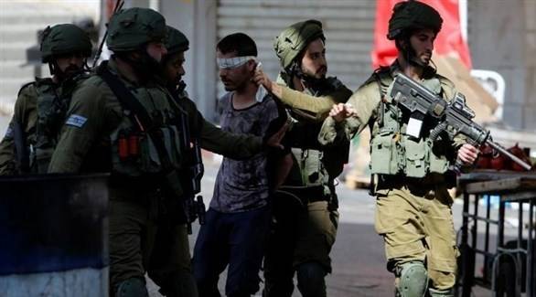 اعتقال 14 فلسطينيا في الضفة الغربية