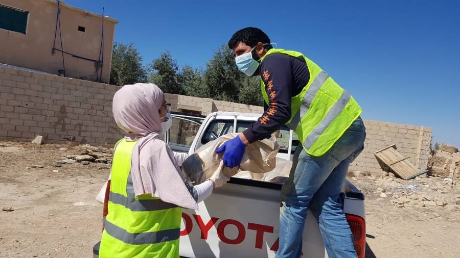 الهيئة الخيرية الأردنية الهاشمية بالتعاون مع جمعية ملتقى نشميات معان توزع الطرود الغذائية في معان