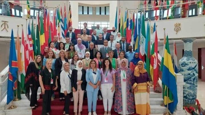 رئيسة وحدة تكافؤ الفرص في بنك التنمية تشارك في ورشة عمل في الصين  مصوّر